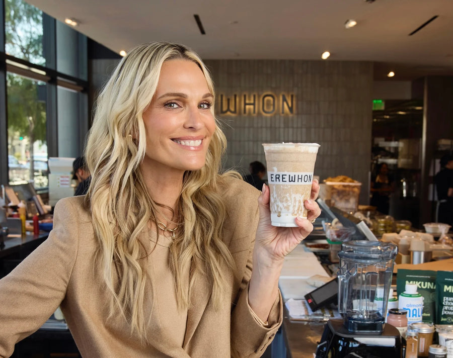 Molly Sims holding her Beauty Elixir Smoothie at an Erewhon Tonic Bar
