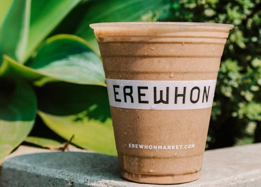 An Erewhon Tonic Bar cup on a ledge outdoors